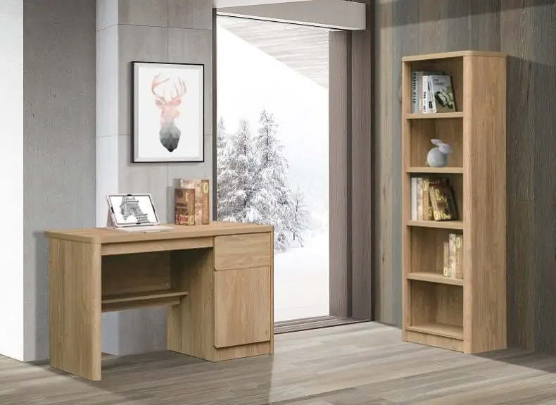 Light wood home office furniture set featuring a compact desk with storage and a tall bookcase, styled with books and décor beside a large window with a snowy outdoor view.
