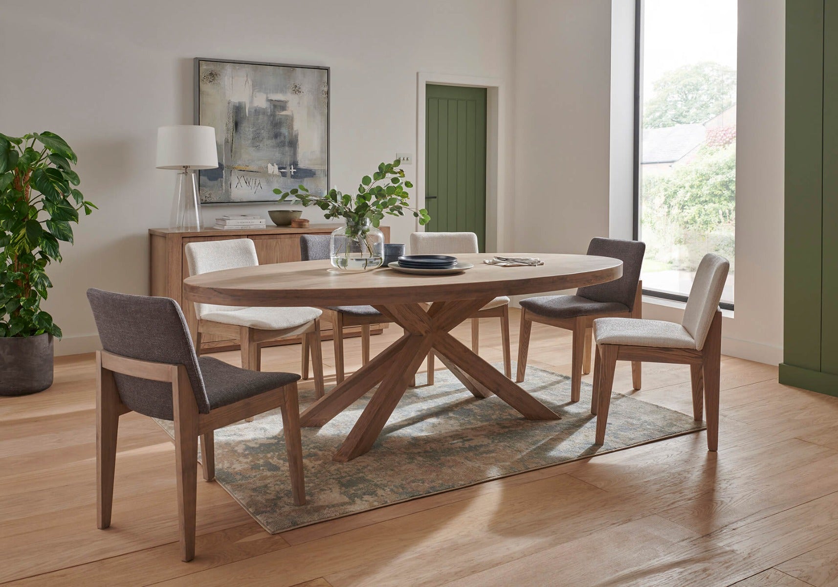 Falun Medium Oval Dining Table – Smoked Oak with Solid Oak Legs